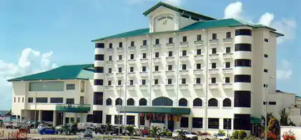 Large, white Seafest Hotel, a 3-star luxury seafront hotel located on the waterfront in Semporna, Sabah.