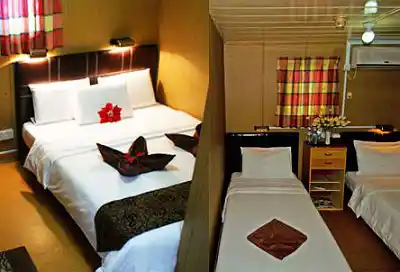 Comfortable cabin accommodations on the Seaventures Dive Rig, showing both double and twin room options.