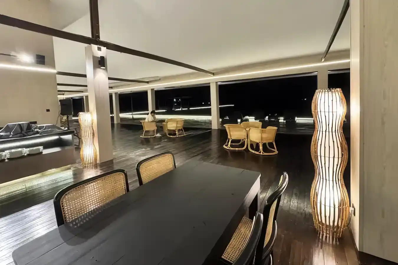 Chic and minimalist open-air restaurant at Sky Resort Timbun Mata, with stylish modern furniture for enjoying the evening sea breeze.