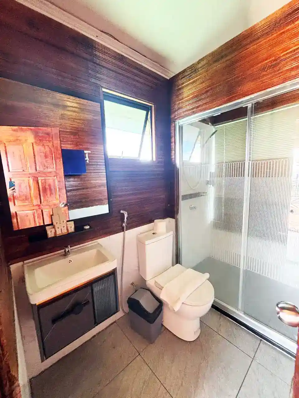 Clean and functional bathroom inside a chalet at Sky Water Villas, with a walk-in shower and modern amenities.