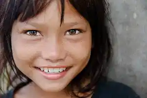 Heartwarming and genuine smile from a local girl of the Mabul Island community, capturing the spirit of the people of Sabah.